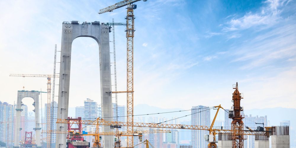 Construction of tall concrete pylon of bridge using tower crane